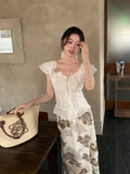 Xixi 2025 Summer New Elegant Temperament Flowers V Collared Leaf-Side Shirt Thin Top Lady